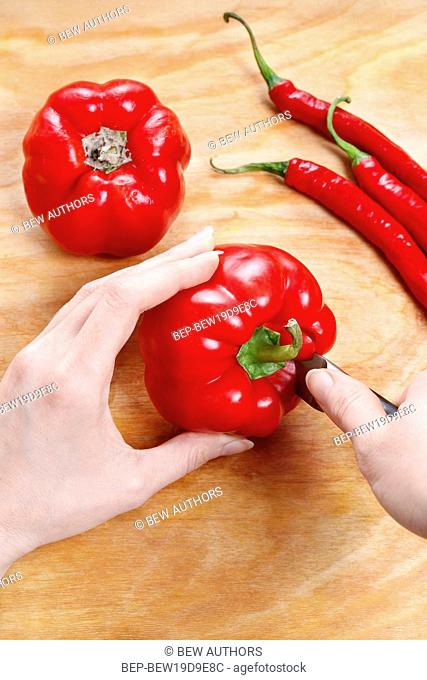 Removing pepper seeds. Making vegetable dish
