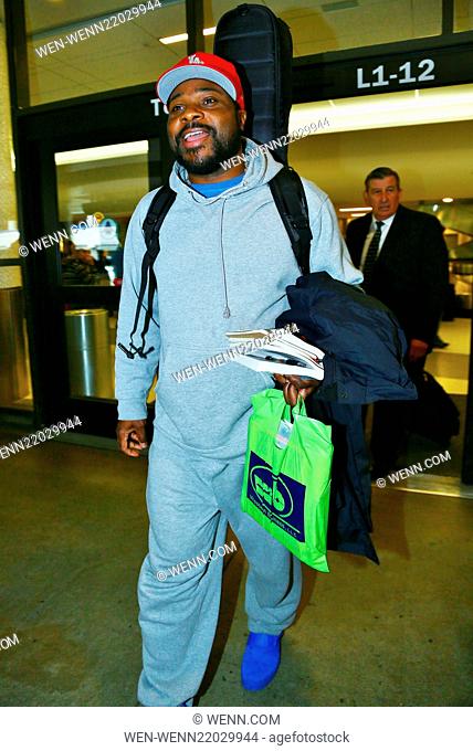 Malcolm-Jamal Warner arrives on a flight to Los Angeles International Airport (LAX) carrying a guitar case on his back Featuring: Malcolm-Jamal Warner Where:...