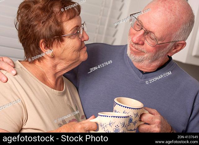 Affectionate Happy Senior Couple Portrait Indoors
