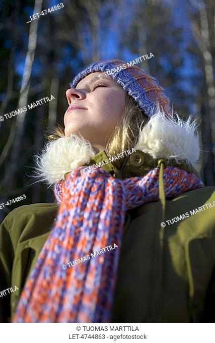 Woman weating knitted cap and scarf