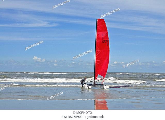 person launching a catamaran, Germany, Lower Saxony, East Frisia