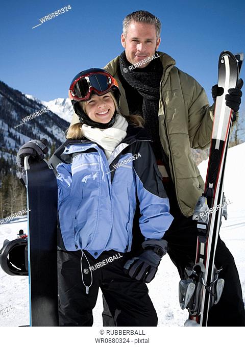 Portrait of a father and his daughter in ski-wear