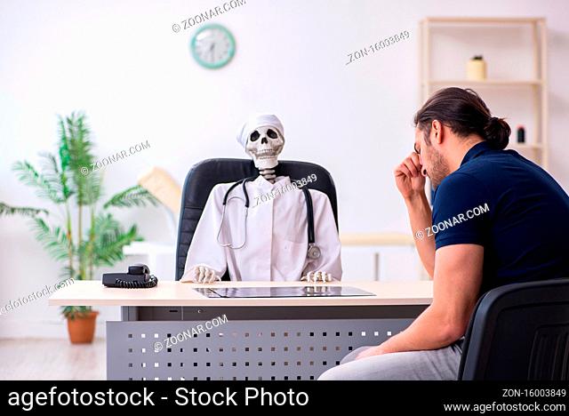 Young man visiting dead doctor in hospital