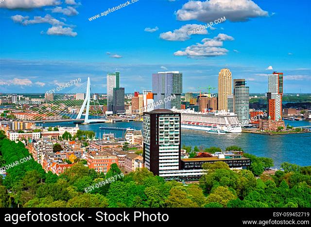 View of Rotterdam city and the Erasmus bridge Erasmusbrug over Nieuwe Maas river with cruise liner from Euromast