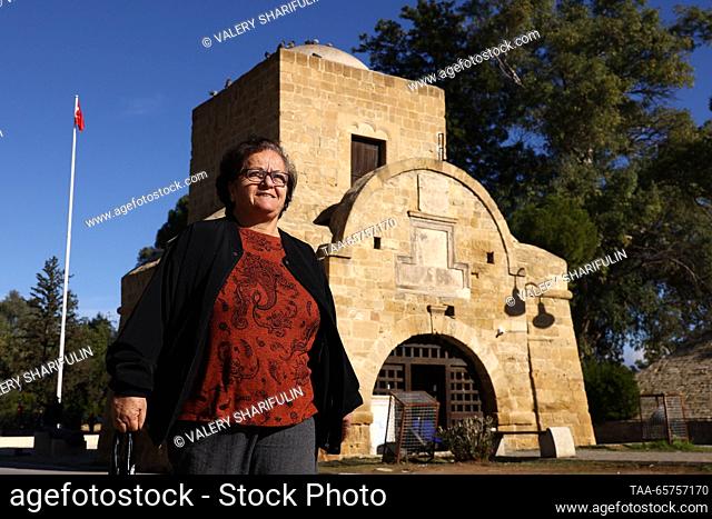 CYPRUS, NICOSIA - DECEMBER 14, 2023: A woman strolls past the 16th-century Kyrenia Gate. The Turkish Republic of Northern Cyprus is a de facto state declared...