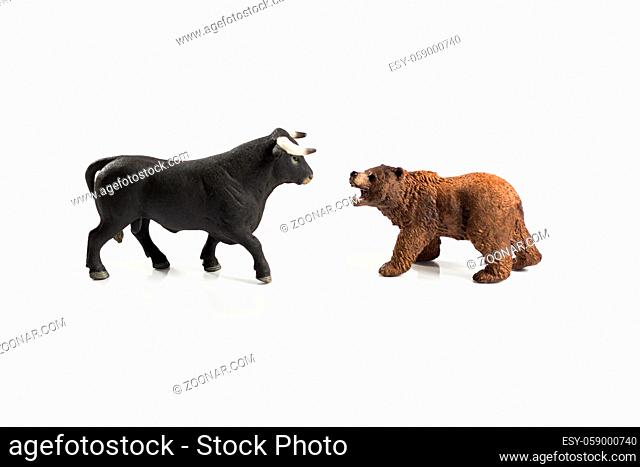 Stock market, securities trading and capitalism concept with a bull and bear concepts. On white background for cutout and copy space