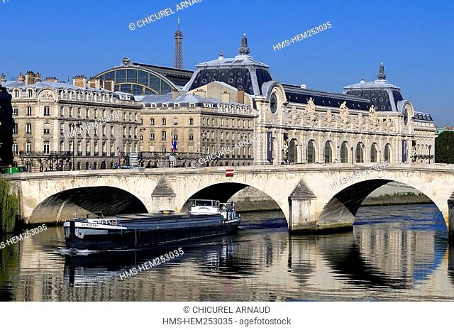 France, Paris, the Orsay museum, the pont Royal Royal bridge and a barge on the Seine river