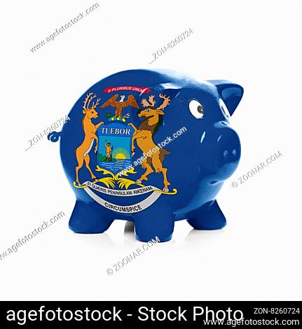 Green piggy bank with dollars sticking out - isolated on white background