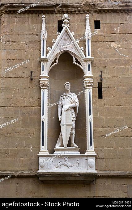 The statue of San Giorgio di Donatello in one of the niches of the external tabernacles of the church of Orsanmichele, formerly also known as the church of San...
