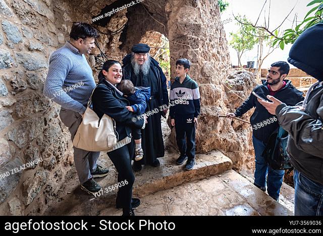 Father Dario Escobar Maronite monk meets with tourists in his hermitage of Our Lady of Hawqa in Kadisha Valley also called Holy Valley in Lebanon
