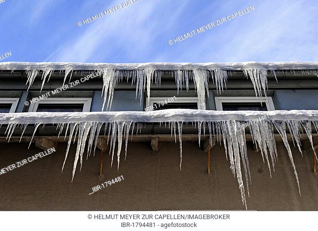 Icicles on the eaves of a hotel, Schlossberg Osternohe, Middle Franconia, Bavaria, Germany, Europe