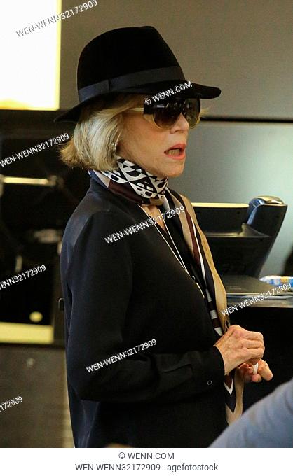 Jane Fonda shows up to Los Angeles International Airport wearing a fedora, silk scarf, and gold sandals Featuring: Jane Fonda Where: Los Angeles, California