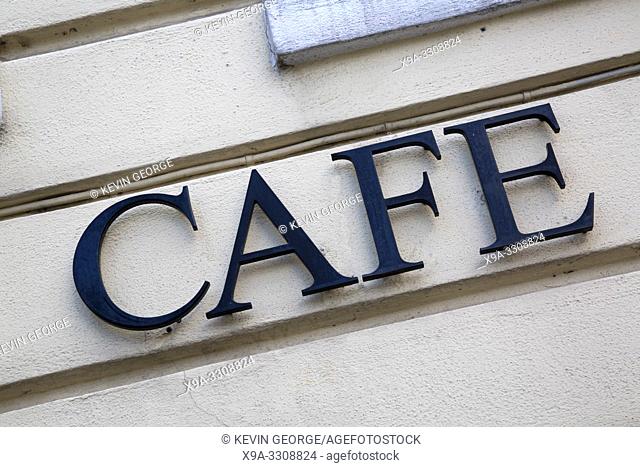 Cafe Sign on Building Wall