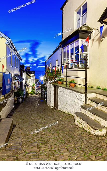 Steep narrow cobbled street leading down to the world famous fishing village of Clovelly, Devon, England, United Kingdom, Europe