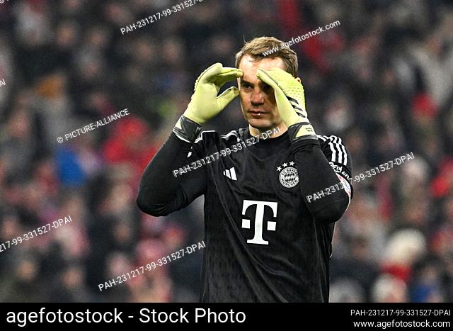 17 December 2023, Bavaria, Munich: Soccer: Bundesliga, Bayern Munich - VfB Stuttgart, Matchday 15, Allianz Arena. Munich goalkeeper Manuel Neuer holds his hands...