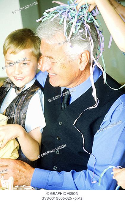 Close-up of a grandfather smiling at grandson