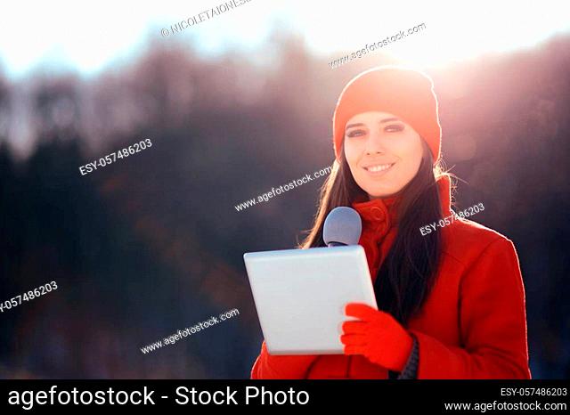 Professional journalist working on field in wintertime