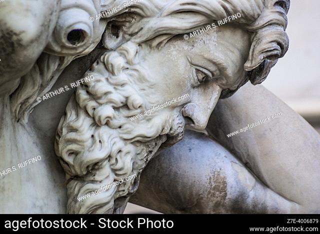 Detail, one of two fountain tritons. Amenano Fountain, Piazza Duomo, Metropolitan City of Catania, Sicily, Italy