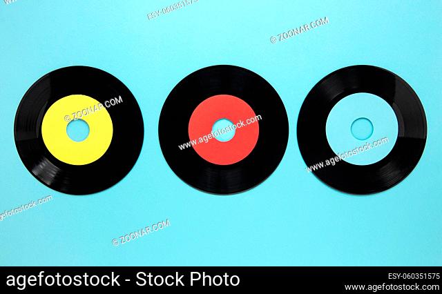 flat lay old disc records blue background