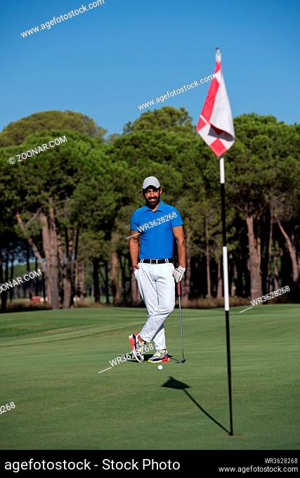 handsome middle eastern golf player portrait at course at sunny day