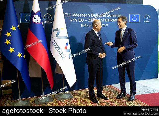 Slovenia's Prime Minister Janez Jansa (L) welcomes Prime Minister Alexander De Croo prior to the plenary session of the heads of delegations on the second day...