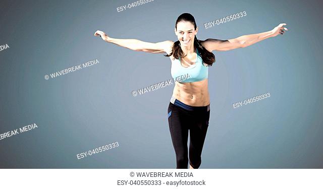 Athletic exercise woman with blank blue background