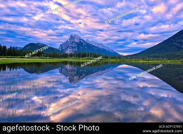 Clouds and Mt. Rundle reflected in Vermillion Lakes at sunrise Banff National Park Alberta Canada