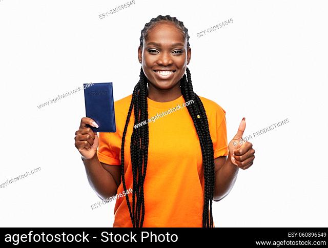 happy woman with passport over white background
