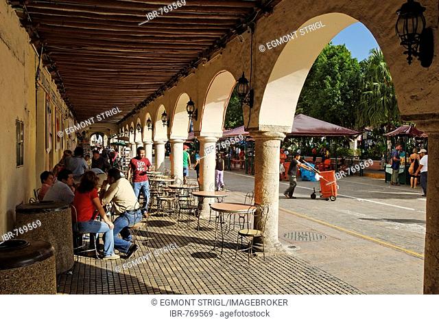 Arched passageway and sidewalk cafe in the historic centre of Merida, Yucatan, Mexico