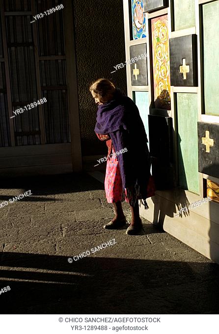 An elderly indigenous woman stands at the entrance of the Our Lady of Guadalupe Basilica in Mexico City, December 10, 2010  Hundreds of thousands of Mexican...