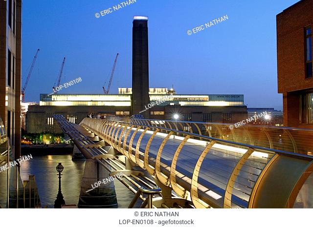 England, London, South Bank, The Millennium Bridge and the Tate Modern art gallery in London at dusk.The bridge is a footbridge only and is the first new bridge...