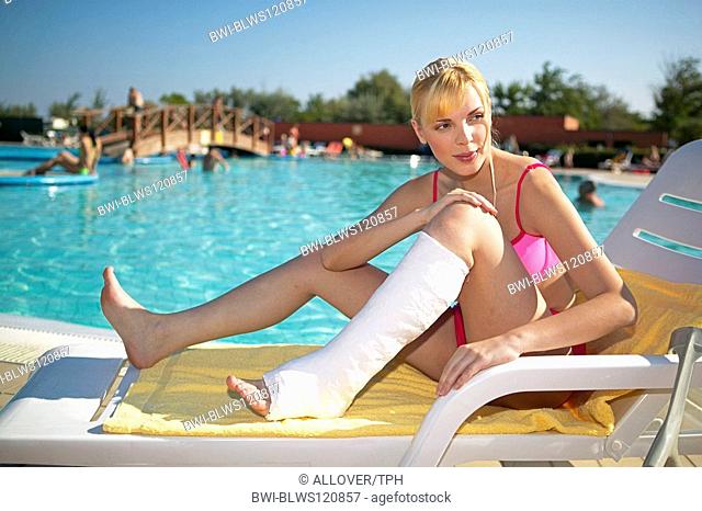 woman with leg in cast at the pool