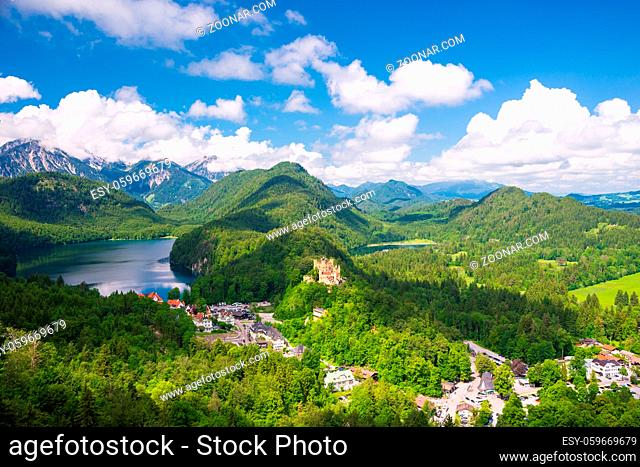 Castle Hohenschwangau, eternal forest with blue mountains and lakes of Bavaria, Germany
