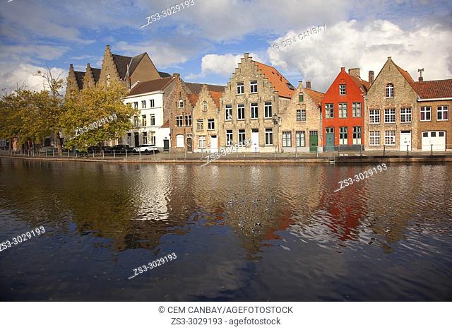 Colorful traditional buildings by the canal at the historic center, Bruges, West Flanders, Belgium, Europe