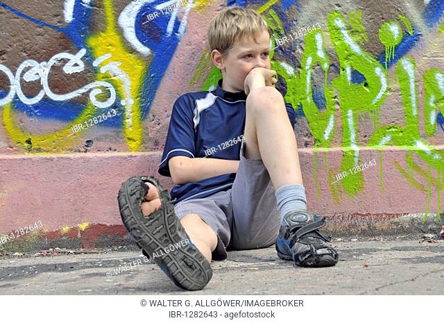 9-year-old boy, bored, football ground in Cologne, North Rhine-Westphalia, Germany, Europe