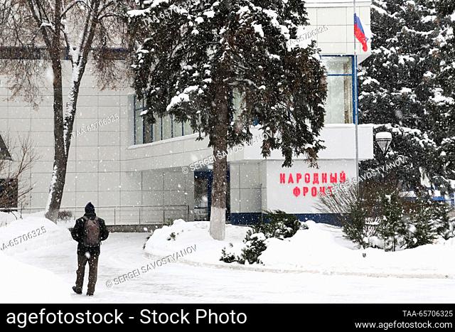 RUSSIA, MOSCOW - DECEMBER 13, 2023: A man heads for the All-Russia People's Front call centre ahead of President Putin's annual special televised...