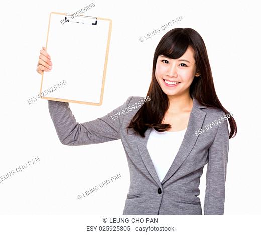 Young businesswoman show with blank page of clipboard