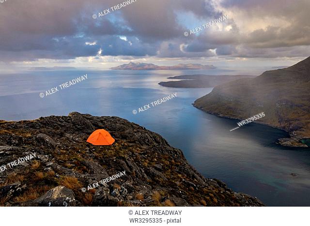 Wild camping on the top of Sgurr Na Stri on the Isle of Skye with views towards the Isle of Soay, Isle of Skye, Inner Hebrides, Scottish Highlands, Scotland