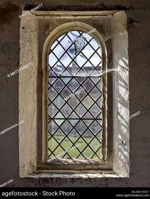 Cobwebs and window, Hospital of St Cross and Almshouse of Noble Poverty, Winchester, UK.Built in the 12th Century to serve the poor in the area