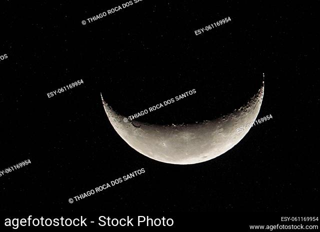 Beautiful photo of the waning moon in close up with dark sky in the background