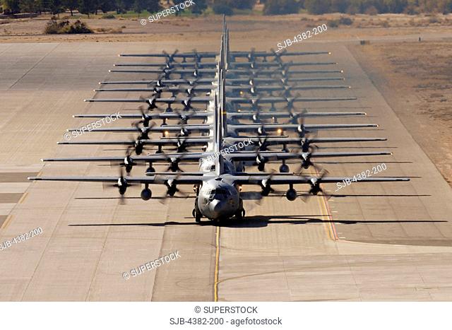 A line of C-130 Hercules taxi during a Mobility Air Forces Exercise on November 18, 2009, at Nellis Air Force Base, Nevada. U.S