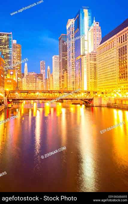 City of Chicago downtown and River with bridges at dusk