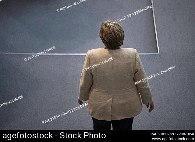 07 September 2021, Berlin: Chancellor Angela Merkel (CDU) stands in the plenum in the German Bundestag. In what is expected to be its last debate of the...