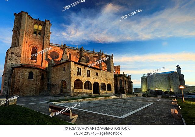 Santa María de la Asuncion Church and lighthouse at dawn. Castro Urdiales, Cantabria, Spain