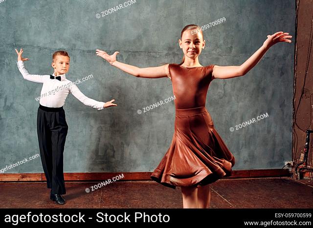 Young dancers boy and girl dancing ballroom dance Samba