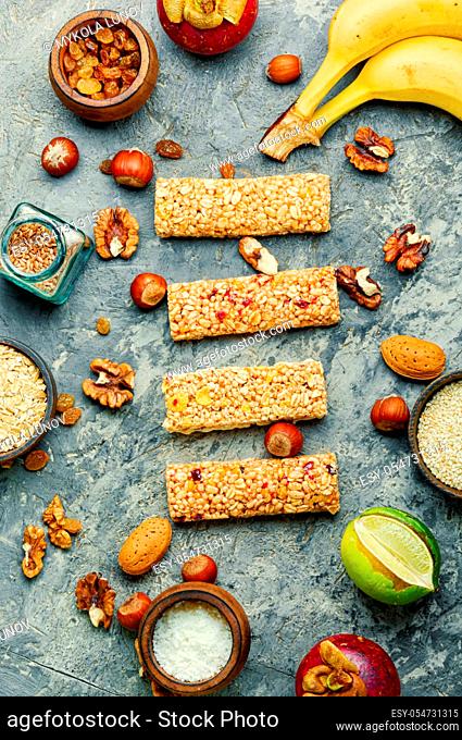 Granola bar and ingredients.Homemade rustic granola bars with dried fruits and nuts.Healthy sweet dessert