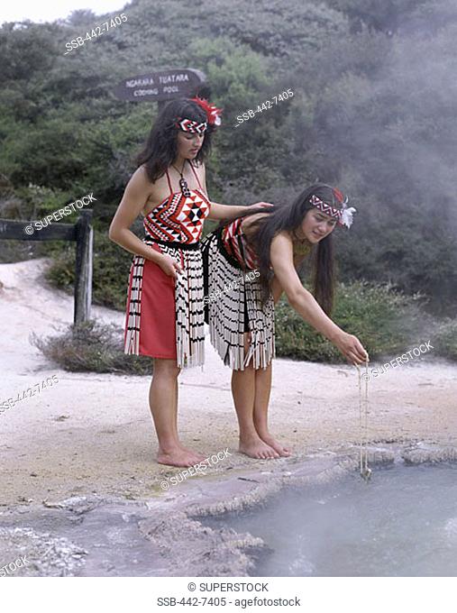 Maori Women Cooking in Hot Spring Wearing Traditional Costume, Rotorua, North Island, New Zealand