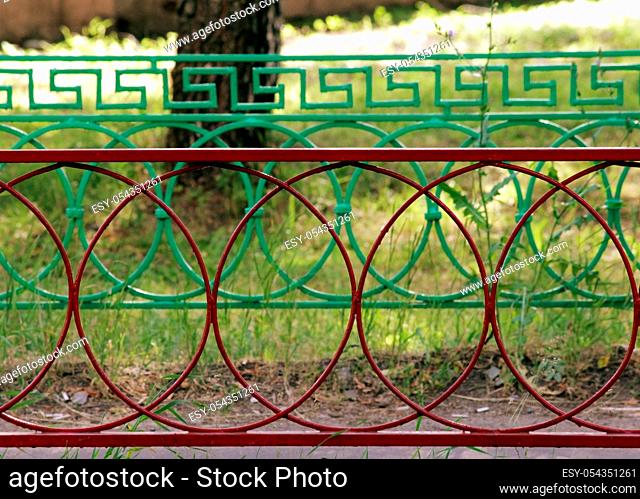 multicolored metal fence made of red, yellow, green, and blue colors