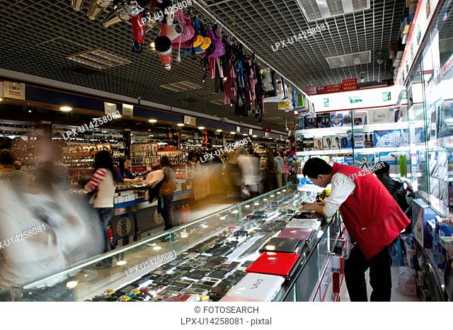 People shopping in Silk Street Market, Beijing, China