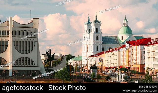 Grodno, Belarus. Grodno Regional Drama Theatre, St. Francis Xavier Cathedral And Traffic In Mostowaja And Kirova Streets In Sunny Summer Day